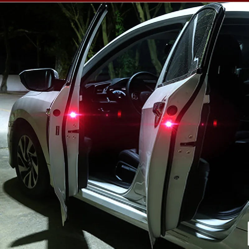 Wireless door-open safety strobe lights flashing red on open car doors at night