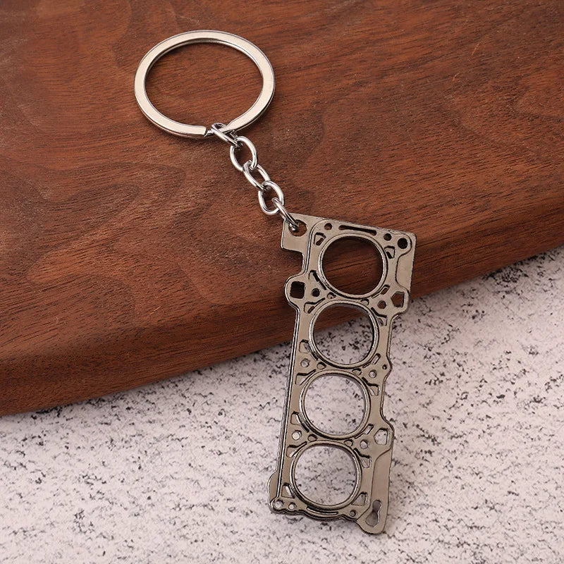 Chaveiro de peças de carros