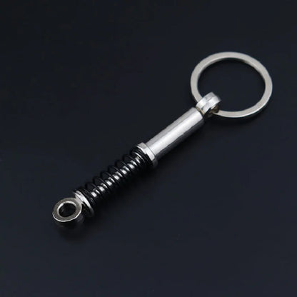 Chaveiro de peças de carros
